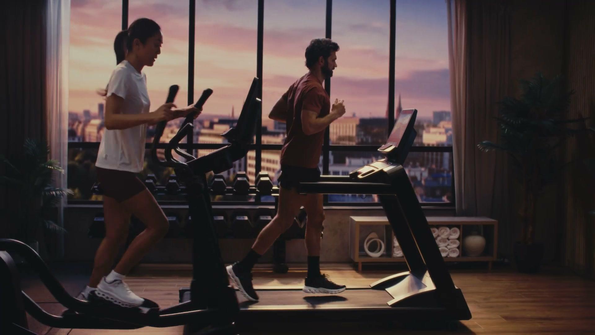 Life Fitness Atmos treadmill and elliptical together at sunset on the LED volume