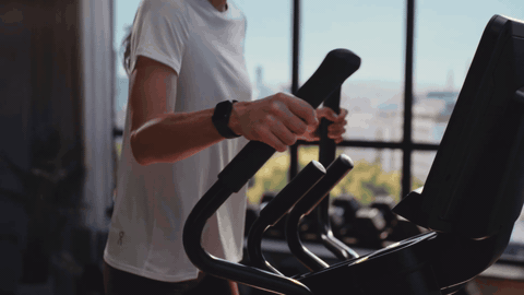 Life Fitness Atmos elliptical in motion, animated loop with city skyline backplate