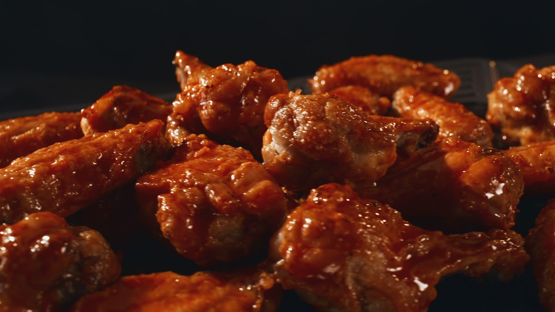 Side-on macro of dehydrated apple slices on a metal tray, warm cinematic lighting.
