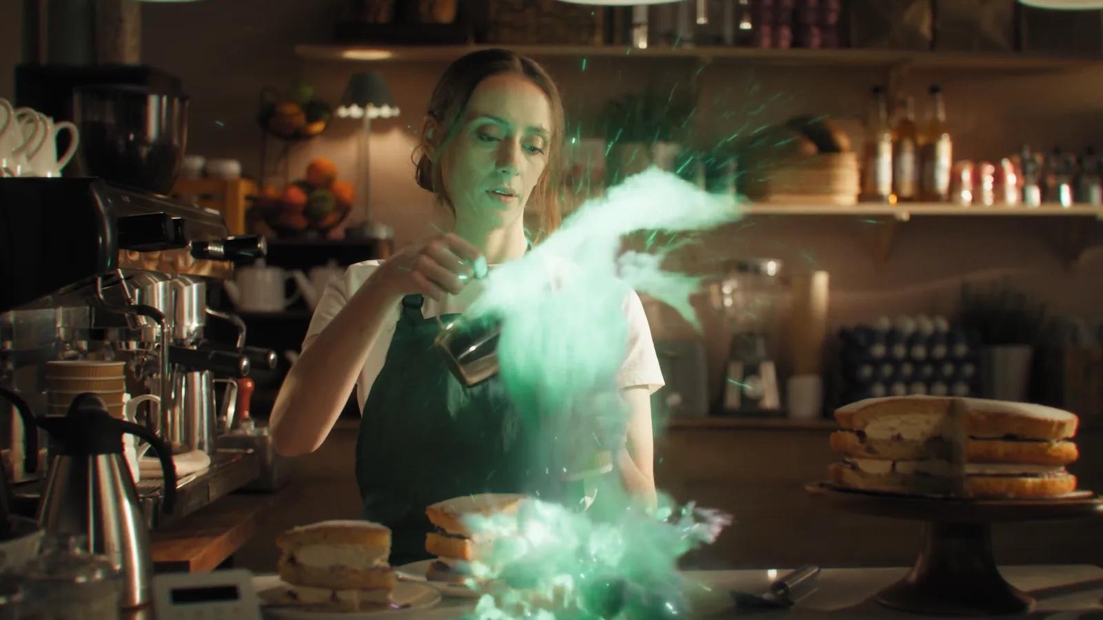 Dark-elf alchemist smiles over a candlelit potion table.