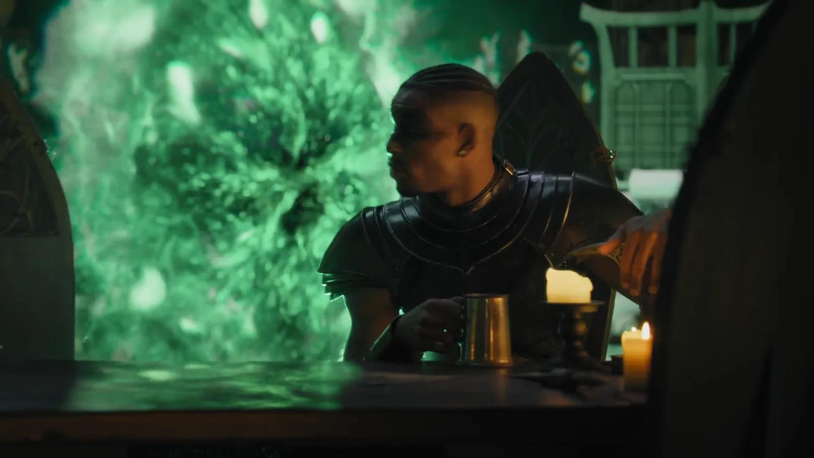 A glowing green spectral figure rises behind an alchemist and a warrior.